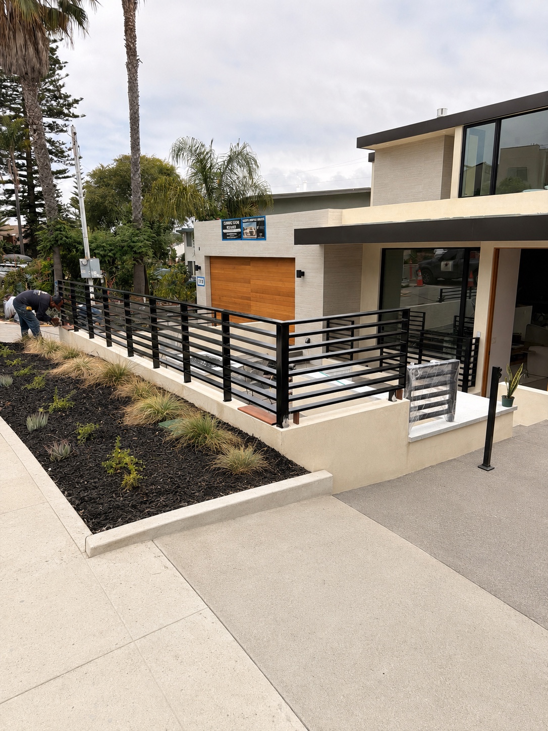 Modern black iron fence and railing installation